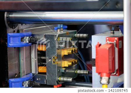 mold closeup in plastic injection moulding machine mold closeup in plastic injection moulding machine 142109745