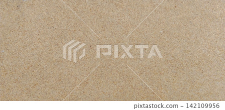 Light brown particle board with a wood-grain textured surface. Light brown particle board with a wood-grain textured surface. 142109956