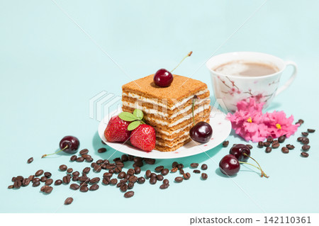 Tasty cake and coffee cup with decoration Tasty cake and coffee cup with decoration 142110361