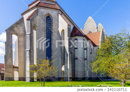 Grundtvig Church exterior with vertical windows and tiled roof in Copenhagen Denmark. Grundtvig Church exterior with vertical windows and tiled roof in Copenhagen Denmark. 142110711