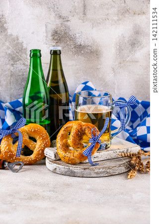 Bavarian brezel and beer, Oktoberfest food Bavarian brezel and beer, Oktoberfest food 142111534