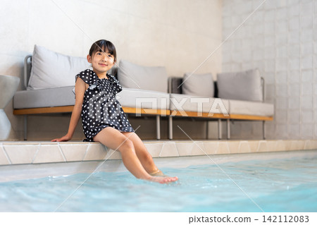 Girls playing in the pool Girls playing in the pool 142112083