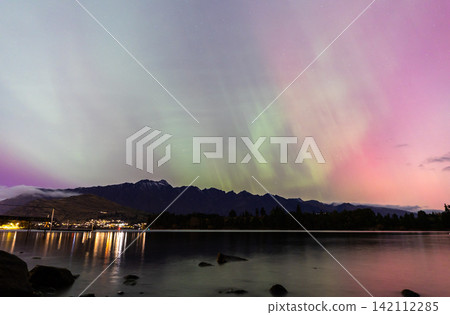 Aurora borealis spreading across the night sky over Queenstown Aurora borealis spreading across the night sky over Queenstown 142112285