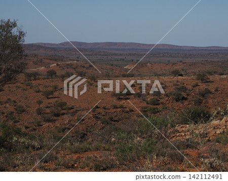 The plains landscape of the Silverton moorland—an inland topographic record revealed by scattered shrubland foreground and rolling hills. The plains landscape of the Silverton moorland—an inland topographic record revealed by scattered shrubland foreground and rolling hills. 142112491