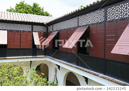 Traditional architecture of Mandarin House built in 1869 with wooden shutter windows geometric lattices and roof tiles Traditional architecture of Mandarin House built in 1869 with wooden shutter windows geometric lattices and roof tiles 142113145