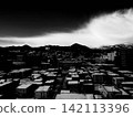 A high-contrast, monochrome image of Sapporo's residential area and clouds. 142113396