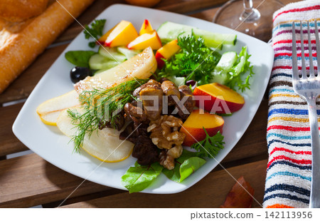 Salad of chicken hearts with peach, pear, fried cheese Salad of chicken hearts with peach, pear, fried cheese 142113956