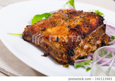 Rack of pork with greens Rack of pork with greens 142113981