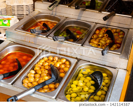 Pickled olives in bulk in store Pickled olives in bulk in store 142114387