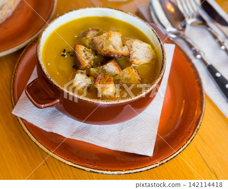 Pureed soup with croutons Pureed soup with croutons 142114418