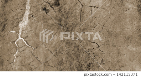 A concrete surface with cracks and fissures resembling lightning. A concrete surface with cracks and fissures resembling lightning. 142115371