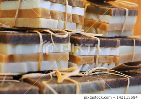 Handmade soap stacked in a market display Handmade soap stacked in a market display 142115684