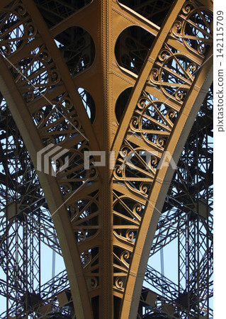 The Eiffel Tower, built for the Paris World's Fair, is a symbol of Paris and a popular tourist attraction. 142115709