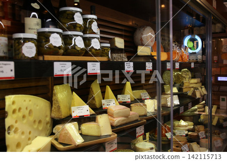 A Parisian cheese shop with over 100 varieties of cheese. A Parisian cheese shop with over 100 varieties of cheese. 142115713