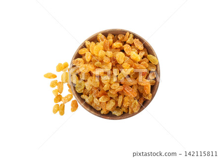 Dried fruits spread out from a bowl on a white surface Dried fruits spread out from a bowl on a white surface 142115811