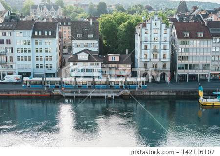 Scenic panoramic view of historic old town cityscape with Limmat River, tram and church towers from Lindenhof hill viewpoint in capital financial city. ZURICH, SWITZERLAND, JUNE 13, 2026 Scenic panoramic view of historic old town cityscape with Limmat River, tram and church towers from Lindenhof hill viewpoint in capital financial city. ZURICH, SWITZERLAND, JUNE 13, 2026 142116102