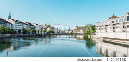 panoramic view of historic old town cityscape with Limmat River and famous church towers from central bridge in financial capital city of Switzerland ZURICH, SWITZERLAND, JUNE 13, 2026 panoramic view of historic old town cityscape with Limmat River and famous church towers from central bridge in financial capital city of Switzerland ZURICH, SWITZERLAND, JUNE 13, 2026 142116168