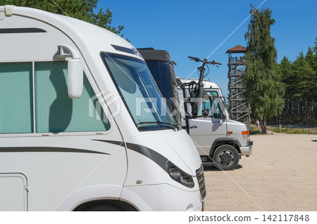 Tourist Camper Vans Parked at Cape Kolka on the Baltic Sea Coast in Latvia During Summer Travel Tourist Camper Vans Parked at Cape Kolka on the Baltic Sea Coast in Latvia During Summer Travel 142117848