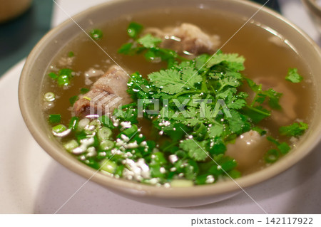 Hawaiian specialty oxtail soup served with cilantro and green onions. Hawaiian specialty oxtail soup served with cilantro and green onions. 142117922