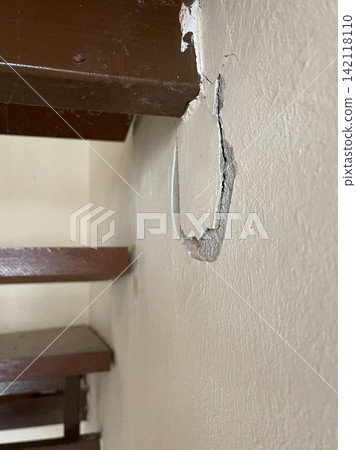 Wall Crack and Peeling Paint Beside Staircase Wall Crack and Peeling Paint Beside Staircase 142118110