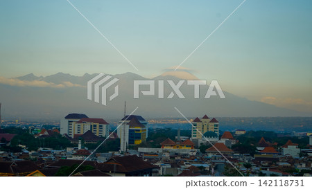 A beautiful view of the city of Malang with Mount Semeru in the background. 142118731