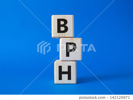 BPH - Benign Prostatic Hyperplasia symbol. Wooden cubes with word BPH. Beautiful blue background. Medical and BPH concept. Copy space. BPH - Benign Prostatic Hyperplasia symbol. Wooden cubes with word BPH. Beautiful blue background. Medical and BPH concept. Copy space. 142120971