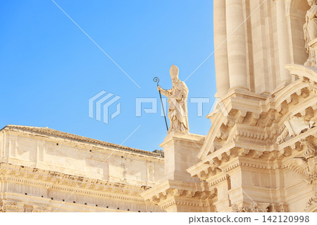 grand stone facade religious building classical columns ornate carvings and prominent sculpture of pope grand stone facade religious building classical columns ornate carvings and prominent sculpture of pope 142120998