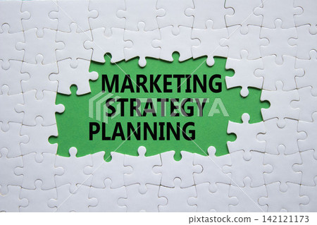 Marketing Strategy Planning symbol. White puzzle with words Marketing Strategy Planning. Beautiful deep background. Business concept. Copy space. Marketing Strategy Planning symbol. White puzzle with words Marketing Strategy Planning. Beautiful deep background. Business concept. Copy space. 142121173