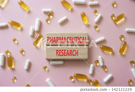 Pharmaceutical research symbol. Concept word Pharmaceutical research on wooden blocks. Beautiful pink background with pills. Medicine and Pharmaceutical research. Copy space Pharmaceutical research symbol. Concept word Pharmaceutical research on wooden blocks. Beautiful pink background with pills. Medicine and Pharmaceutical research. Copy space 142121229