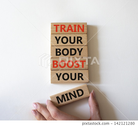 Train your body boost your mind symbol. Concept words train your body boost your mind on wooden blocks. Businessman hand. Beautiful white background. Business concept. Copy space. Train your body boost your mind symbol. Concept words train your body boost your mind on wooden blocks. Businessman hand. Beautiful white background. Business concept. Copy space. 142121280