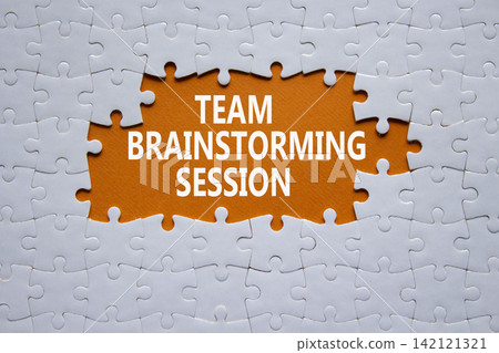 Team Brainstorming Session symbol. White puzzle with words Team Brainstorming Session. Beautiful orange background. Business concept. Copy space. Team Brainstorming Session symbol. White puzzle with words Team Brainstorming Session. Beautiful orange background. Business concept. Copy space. 142121321