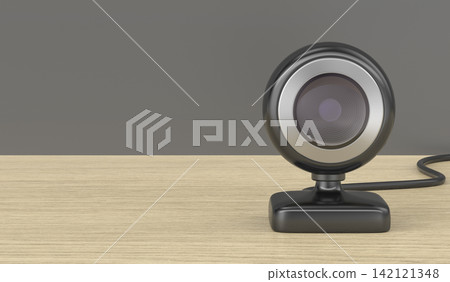 Black web camera on wooden desk Black web camera on wooden desk 142121348