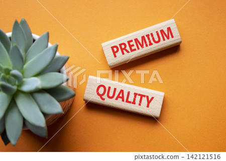 PREMIUM QUALITY symbol. Concept word PREMIUM QUALITY on wooden blocks. Beautiful orange background with succulent plant. Business and PREMIUM QUALITY concept. Copy space PREMIUM QUALITY symbol. Concept word PREMIUM QUALITY on wooden blocks. Beautiful orange background with succulent plant. Business and PREMIUM QUALITY concept. Copy space 142121516