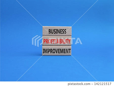 Business profitability improvement symbol. Concept word Business profitability improvement on wooden blocks. Beautiful blue background. Business and Business profitability improvement. Copy space Business profitability improvement symbol. Concept word Business profitability improvement on wooden blocks. Beautiful blue background. Business and Business profitability improvement. Copy space 142121517