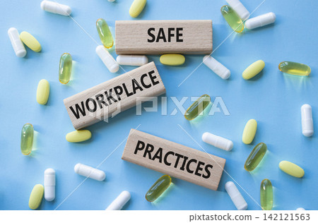 Safe Workplace Practices symbol. Concept words Safe Workplace Practices on wooden blocks. Beautiful blue background with pills. Healthcare and Safe Workplace Practices concept. Copy space. Safe Workplace Practices symbol. Concept words Safe Workplace Practices on wooden blocks. Beautiful blue background with pills. Healthcare and Safe Workplace Practices concept. Copy space. 142121563