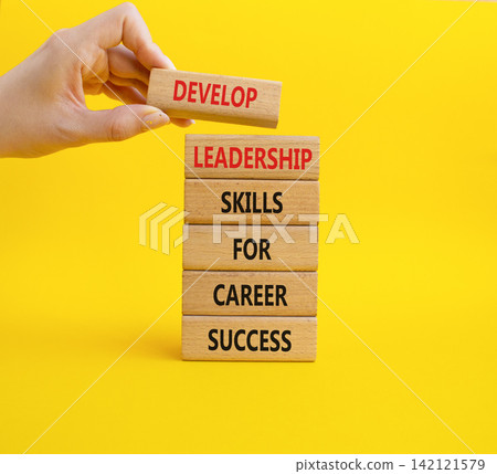 Develop leadership skills for career success symbol. Concept words develop leadership skills for career success on wooden blocks. Businessman hand. Beautiful yellow background. Business concept. Copy Develop leadership skills for career success symbol. Concept words develop leadership skills for career success on wooden blocks. Businessman hand. Beautiful yellow background. Business concept. Copy 142121579