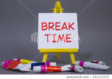 Break Time symbol. Concept word Break Time on wooden blocks. Beautiful grey background with paints and easel. Business and Break Time concept. Copy space Break Time symbol. Concept word Break Time on wooden blocks. Beautiful grey background with paints and easel. Business and Break Time concept. Copy space 142121615