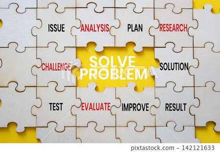 Solve problem symbol. Concept words solve problem on wooden puzzle pieces. Beautiful yellow background. Problem solving concept. Copy space. Solve problem symbol. Concept words solve problem on wooden puzzle pieces. Beautiful yellow background. Problem solving concept. Copy space. 142121633