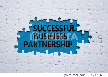 Successful Business Partnership symbol. White puzzle with words Successful Business Partnership. Beautiful blue background. Business concept. Copy space. Successful Business Partnership symbol. White puzzle with words Successful Business Partnership. Beautiful blue background. Business concept. Copy space. 142121636