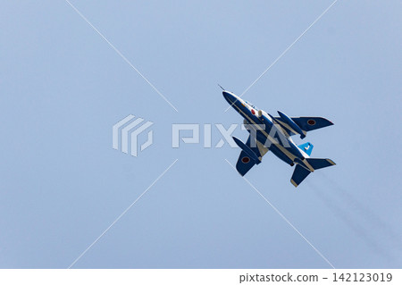 The Blue Impulse aerobatic team performs an air show in a clear blue sky. The Blue Impulse aerobatic team performs an air show in a clear blue sky. 142123019