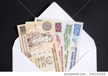 Cypriot pound in a white envelope Cypriot pound in a white envelope 142123320