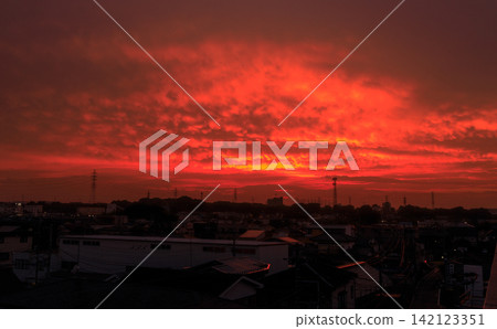 A scene of an unstable and eerily red-burning evening sky. A scene of an unstable and eerily red-burning evening sky. 142123351