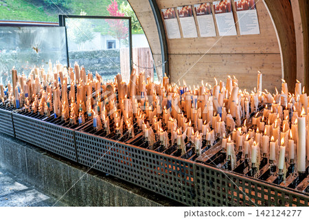 Specially crafted candles burning in Lourdes. One of the great traditions of Lourdes Specially crafted candles burning in Lourdes. One of the great traditions of Lourdes 142124277
