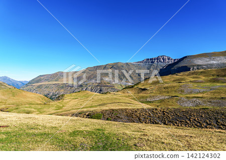 Hiking trail in Cirque de Troumouse at Heas in the Hautes-Pyrenees department in France, forming the border with Spain 142124302