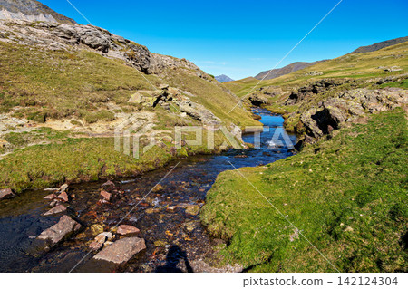 Hiking trail in Cirque de Troumouse at Heas in the Hautes-Pyrenees department in France, forming the border with Spain Hiking trail in Cirque de Troumouse at Heas in the Hautes-Pyrenees department in France, forming the border with Spain 142124304