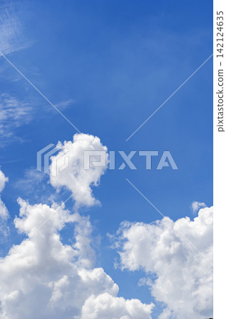 A vibrant blue summer sky with rising white clouds. Photographed in Nerima Ward, Tokyo. A vibrant blue summer sky with rising white clouds. Photographed in Nerima Ward, Tokyo. 142124635