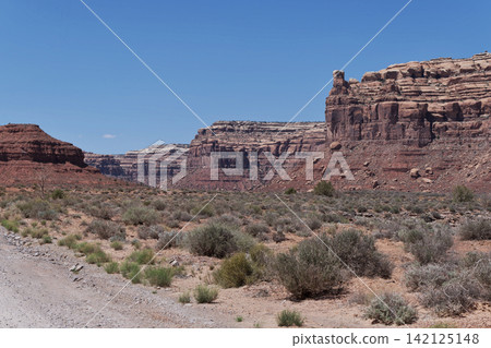 View of Cedar Mesa, the northern cliff, from near Battleship Butte at the back of Valley of God. View of Cedar Mesa, the northern cliff, from near Battleship Butte at the back of Valley of God. 142125148