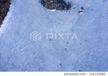 ice hole, frozen lake, aerial view ice hole, frozen lake, aerial view 142125680