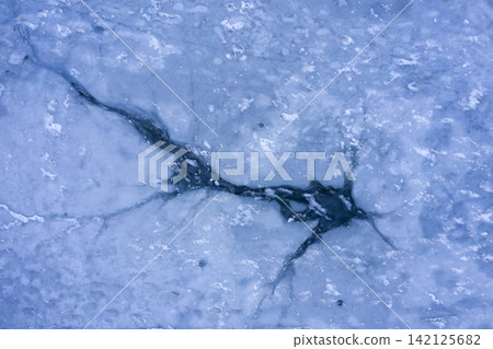 ice hole, frozen lake, aerial view ice hole, frozen lake, aerial view 142125682