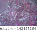 Cyberpunk aesthetic crumpled plastic texture with neon pink light 142126164